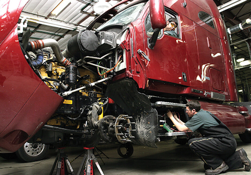 photo of semi truck being repaired